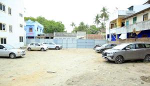 a group of cars parked in a parking lot at SNN Residency in Rāmeswaram