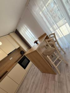 a chair sitting in the middle of a room at Urban Elegance in Cluj-Napoca