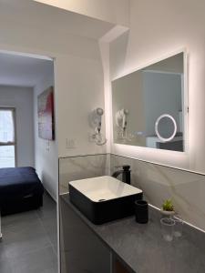 a bathroom with a black sink and a mirror at 101 - Centre de voiron in Voiron +5 photos