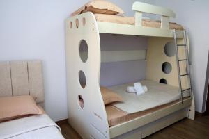 a bunk bed in a bedroom with a bunk bed frame at Joni s Guest House in Krujë