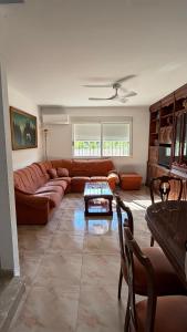 a living room with a couch and a table at Casa Rural Tío Cuchi in Bolbaite