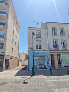 a street light in front of a building at Ancre Zen in Les Sables-d'Olonne +5 photos
