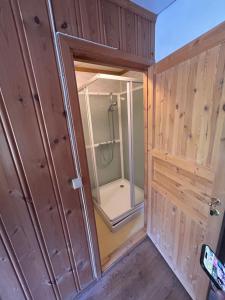a bathroom with a shower and a glass door at Knutehytta in Kongsberg +19 photos