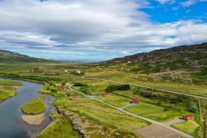 an aerial view of a river and mountains at Hvammur 1 with private hot tub in Drangsnes