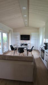 a living room with a couch and a table and chairs at Dom nad wąwozem in Sandomierz +7 photos