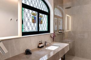 a bathroom with a sink and a stained glass window at Casa Lerma in Mexico City +14 photos