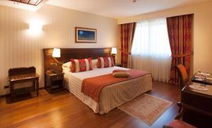 Letto o letti in una camera di Hotel Calissano