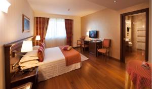 Postel nebo postele na pokoji v ubytování Hotel Calissano + 37 fotografií
