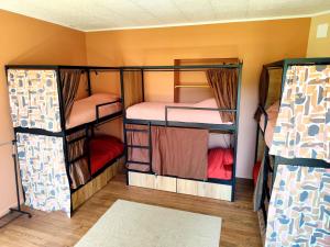 a room with three bunk beds in it at La Pépite in Sénac