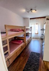 a room with three bunk beds in a room at Hvar old Town Boutique in Hvar