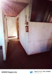 an empty room with a hallway with a door at Narraverrete family in Chillán
