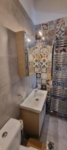 a bathroom with a sink and a toilet at Lemnos Nest in Kondiás