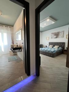 an open door to a bedroom with a bed at La Base Fitness House in Decimomannu