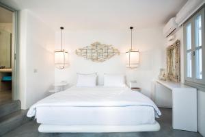 Cama ou camas em um quarto em Blue Sand Boutique Hotel & Suites