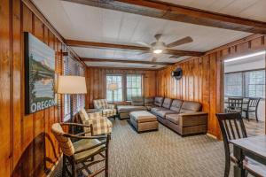 a living room with a couch and a table at Union Creek Resort in Union Creek