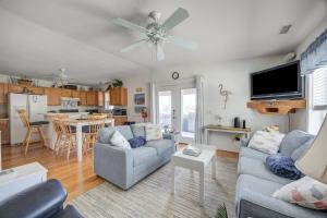 a living room with a couch and a table at 7630 - Obx Box in Avon
