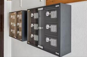 a bunch of lockers are on a wall at Hotel Knurrhahn DZ in Wilhelmshaven