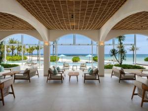 a lobby at the excellence paradisus punta cana resort at Mövenpick Resort & Spa Bintan Lagoon in Lagoi