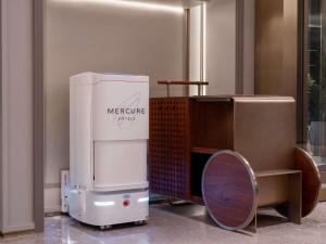 a machine sitting on the floor in a room at Mercure Pingyao Ancient City in Pingyao +103 photos