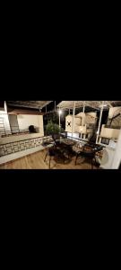 a building with a table and benches in front of it at krishna suraj villa in Chikalda