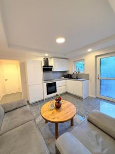 a living room with a couch and a table at Ferienwohnung Otterberg in Otterberg