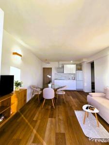 a living room with a couch and a table at Apartments Gabriela in Drasnice