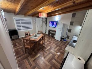 a kitchen and dining room with a table and a refrigerator at Hermoso Departamento - Centro in Río Grande +6 photos