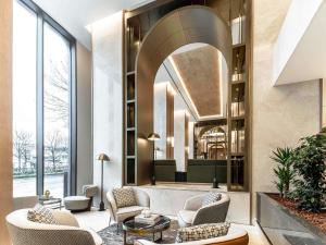 a lobby with chairs and a waiting room at Mövenpick Istanbul Old Town in Istanbul