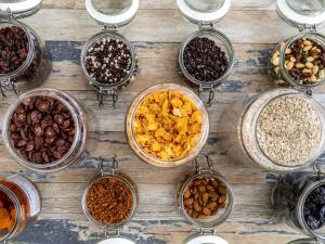 a table with different types of nuts and raisins at Ibis Styles Saint Germain en Laye in Saint-Germain-en-Laye +24 photos
