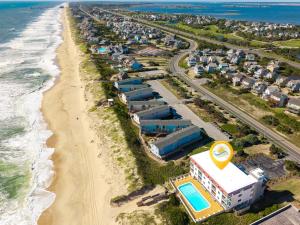 an aerial view of a beach with condos at AV2D - By The Sea in Nags Head