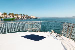 a boat in the water near a body of water at BALI house boat in SantʼAntìoco