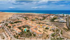 an aerial view of a resort near the ocean at Santa Maria Ilha do Sal T2 Apartament with pool A&L em Vila Verde in Prainha