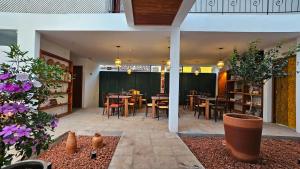 a patio with tables and chairs in a restaurant at Pousada Casa de Salim in Lençóis