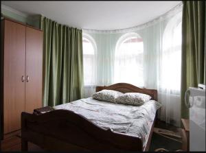 a bedroom with a bed with two pillows on it at Форесок in Vorokhta +13 photos