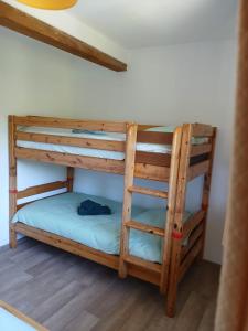 a bunk bedded room with two bunk beds at La maison bleue-Urbès in Urbès