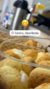 a picture of a glass tray of pastries in a counter at Hotel JCA Uberlândia in Uberlândia +16 photos