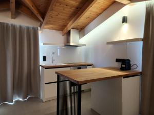 a kitchen with a wooden counter top in a room at Miranda Haus in Arillas