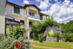 a house with balconies on the side of it at House H-ELIOS in Lovran +31 photos