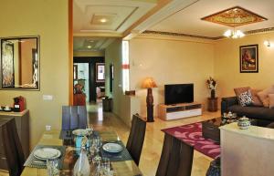 TV a/nebo společenská místnost v ubytování Aparthotel Les Oliviers Suites & Spa
