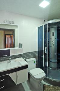 Koupelna v ubytování Aparthotel Les Oliviers Suites & Spa