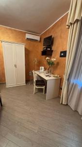 a room with a white table and a white cabinet at B&b MAURO in Gioia Sannitica
