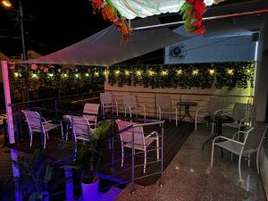 a group of chairs and lights on a patio at Vila Zara in Mamaia Sat/Năvodari +23 photos