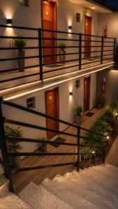 a staircase in a building with potted plants at Pousada Loft Marabá in Marabá
