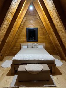 a bedroom with a bed in a attic at Vila Kalkan in Šipovo