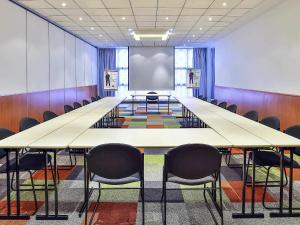 a large conference room with a large table and chairs at ibis Styles Nancy Sud in Houdemont +82 photos