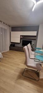 a living room with a glass table and a couch at Devesa Park in Playa de Gandia