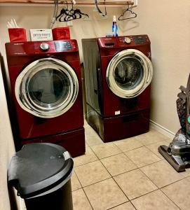 a washing machine and a dryer in a room at Trunks up! Spacious home ready for a fun time! in Lancaster