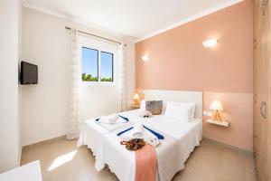 a bedroom with two beds and a window at Villa Situla in Barbati +11 photos