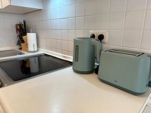 a kitchen counter with two toasters on a counter top at Ferienwohnung mit Terrasse - Hunde willkommen in Falkenstein