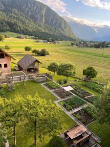 an aerial view of a garden with mountains in the background at Apartment Cvetek Janez in Bohinj